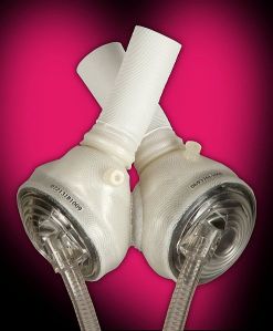 The_SynCardia_temporary_Total_Artificial_Heart_with_pink_heart_background